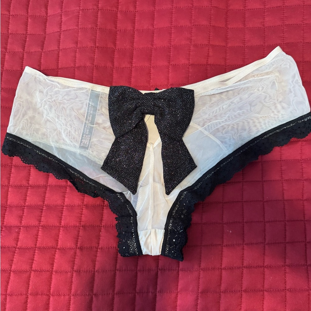 Victoria Secret Sheer White Lace Bikini Panty with Black Bow in back.